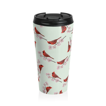 A premium 15oz stainless steel travel tumbler in sage green, featuring a seamless pattern of a Northern Cardinal and cherry blossoms, with a black spill-proof lid. High-quality birdwatching coffee mug in e-commerce.