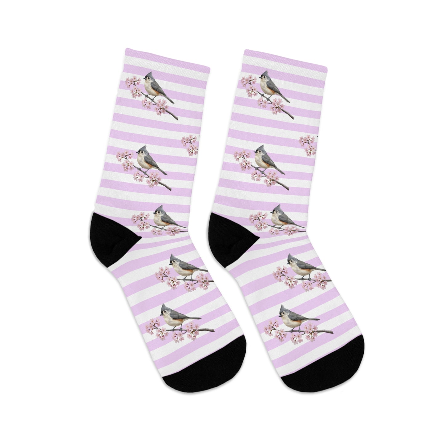 Pair of socks with tufted titmouse bird and floral design on a white background
