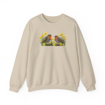 Beige sweatshirt with a graphic of two european robins and flowers on a white background