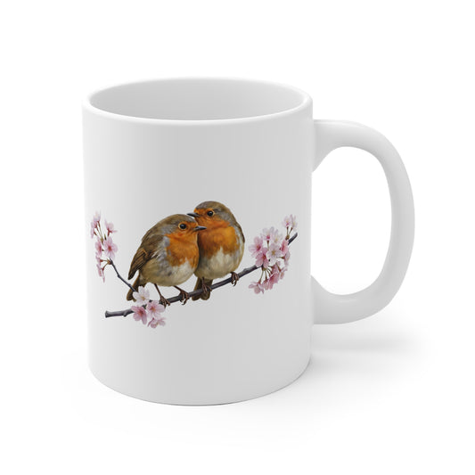 White mug with two birds on a branch design on a white background