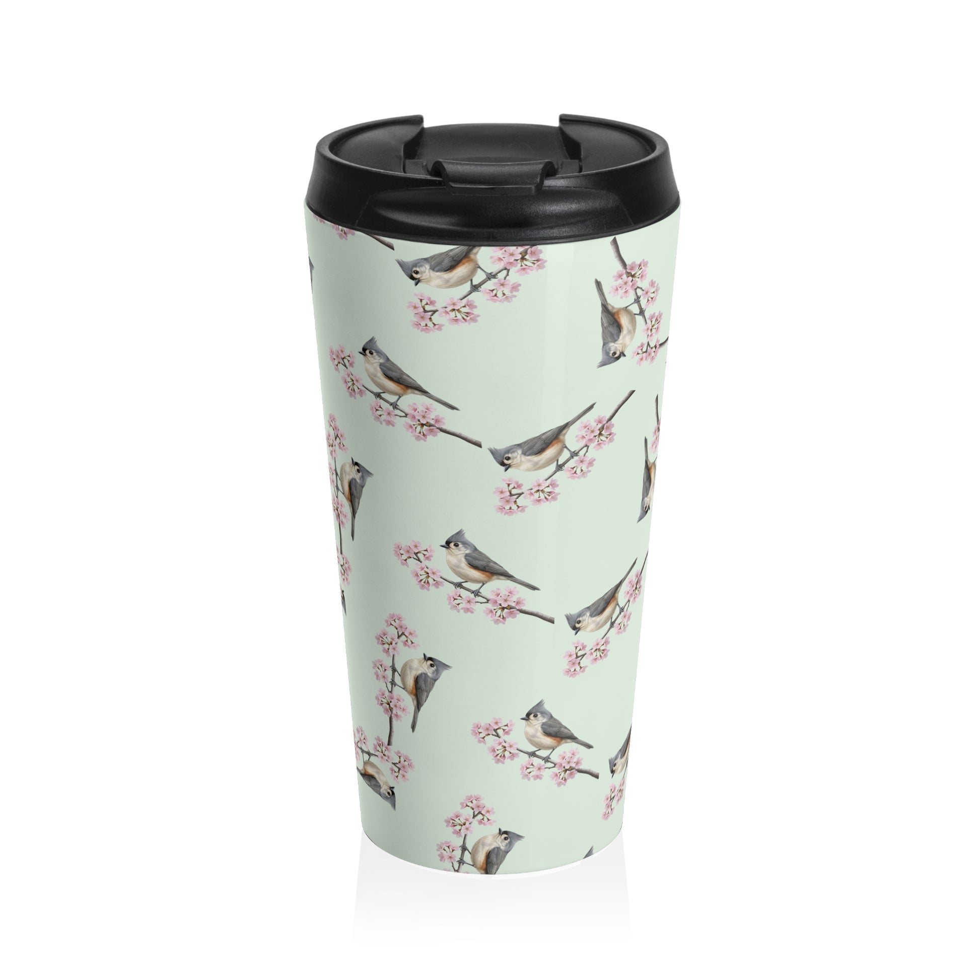 A premium 15oz stainless steel travel tumbler in sage green, featuring a seamless pattern of a Tufted Titmouse and cherry blossoms, with a black spill-proof lid. High-quality birdwatching coffee mug in e-commerce.
